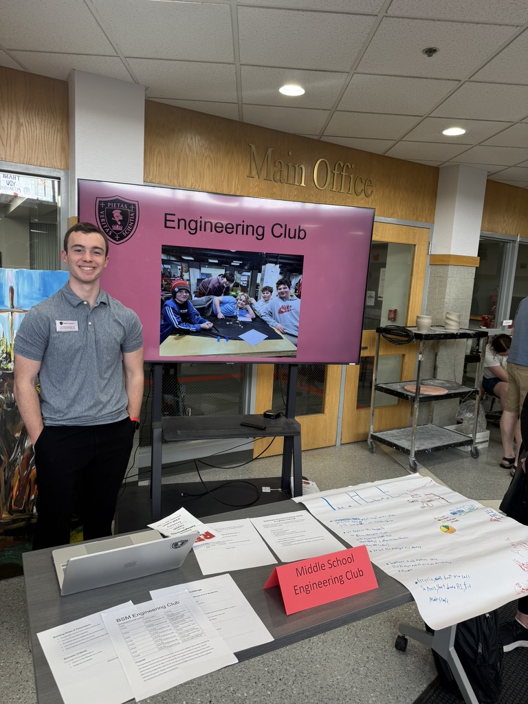 Joe presenting at a club fair about the middle school engineering club he taught